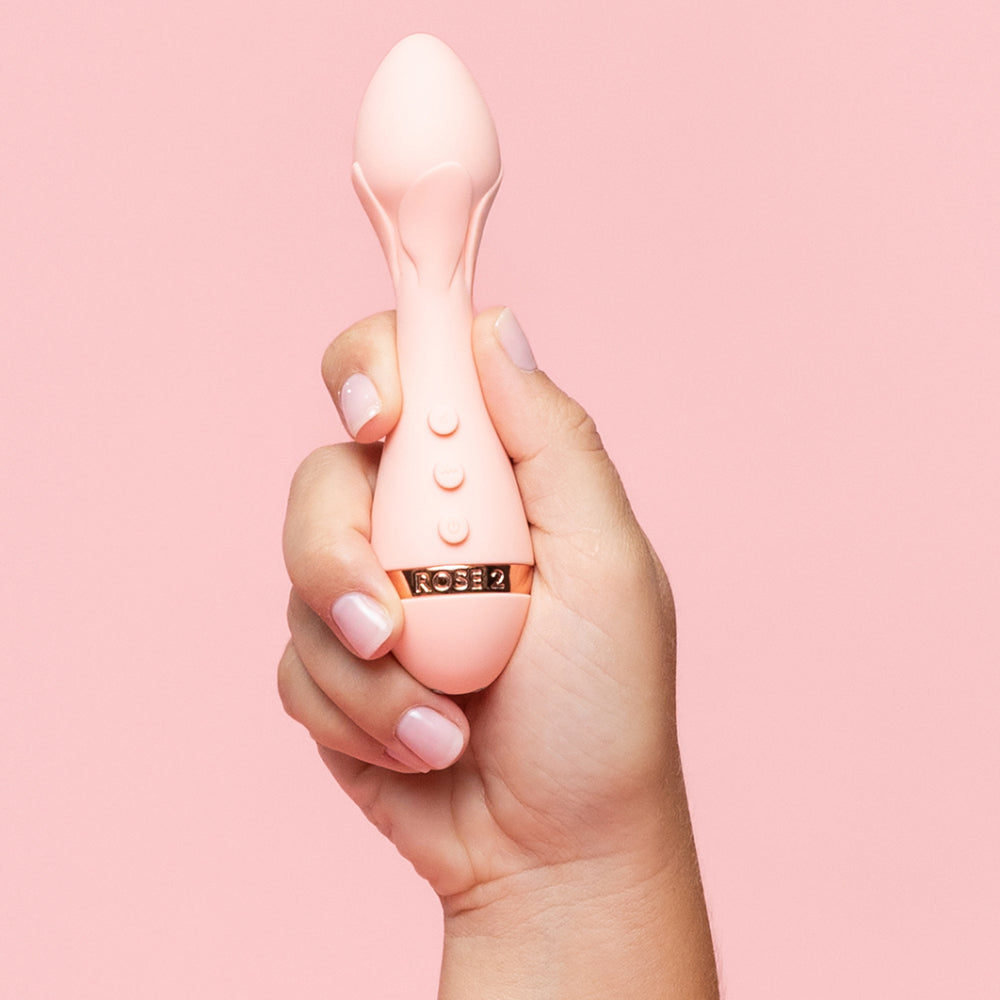 Vush Rose 2 - Precision Bullet Vibrator - flexible bullet vibrator has 5 vibration modes in 5 intensities with a tapered head & petal-like ridges. in hand for size comparison