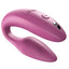 We-Vibe Sync 2 App-Compatible Couples Vibrator With Remote stimulates the wearer's clitoris + G-spot while the flat underside leaves room for a penetrating partner. Pink.