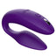We-Vibe Sync 2 App-Compatible Couples Vibrator With Remote stimulates the wearer's clitoris + G-spot while the flat underside leaves room for a penetrating partner. Purple.