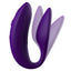 We-Vibe Sync 2 App-Compatible Couples Vibrator With Remote stimulates the wearer's clitoris + G-spot while the flat underside leaves room for a penetrating partner. Purple. Adjustable shape.