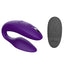 We-Vibe Sync 2 App-Compatible Couples Vibrator With Remote stimulates the wearer's clitoris + G-spot while the flat underside leaves room for a penetrating partner. Purple. Remote.